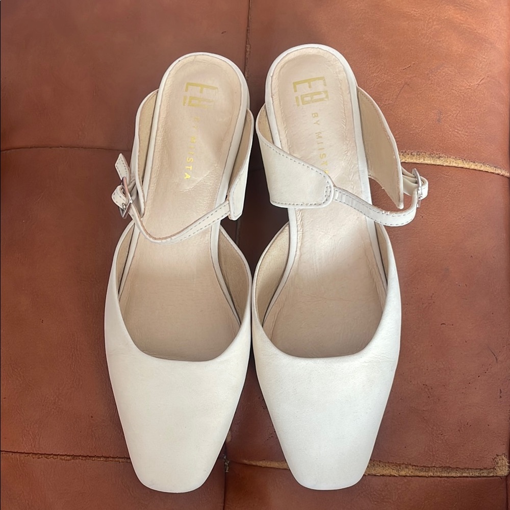 Miista White Mules with Textured Finish and Low Heel.